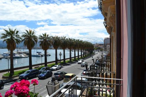 a view from a balcony of a street with palm trees at Bed& Breakfast Maredomus in Milazzo