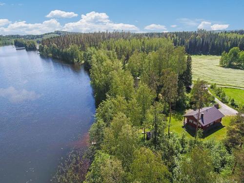 an aerial view of a house next to a river at Holiday Home Kuikanranta by Interhome in Hara