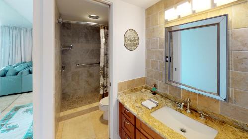 a bathroom with a sink and a shower at Stunning Sunsets and Oceanview's at Paki Maui in Lahaina