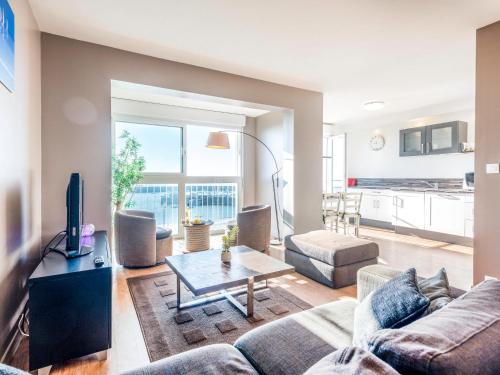 a living room with a couch and a table at Apartment Résidence Kerentrech-3 by Interhome in Quiberon