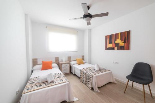 Postel nebo postele na pokoji v ubytování Moonkey - Apartamento Las Naranjas