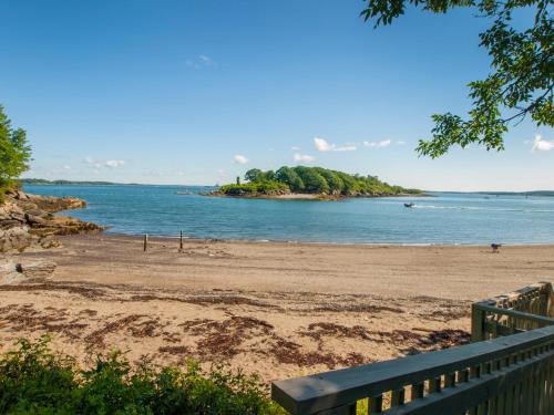 a view of a beach with an island in the water at Inn at Diamond Cove in Portland