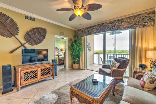 a living room with a couch and a tv at River Strand Country Club Condo with Pool Access! in Bradenton