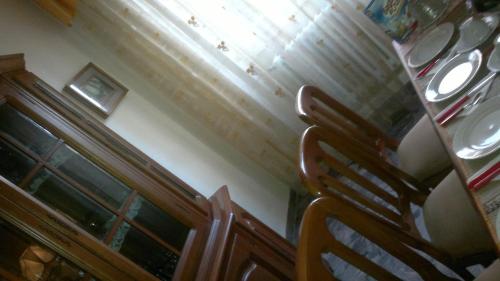 a dining room with a table and a chair at B&B In Centro in San Benedetto del Tronto