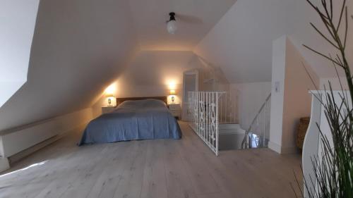 מיטה או מיטות בחדר ב-Dat Schmucke Huus