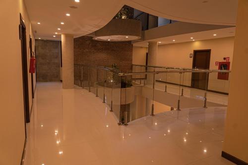 a hallway with a staircase in a building at Chairu Eco Hotel in Santa Cruz de la Sierra