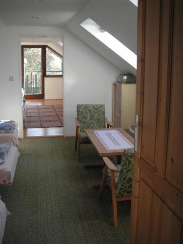 a room with a table and chairs in a room at Prázdninový dům Cihelna in Strmilov