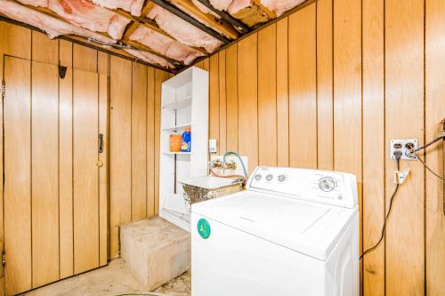 a washer and dryer in a room with wooden walls at Lily Haus in Idyllwild