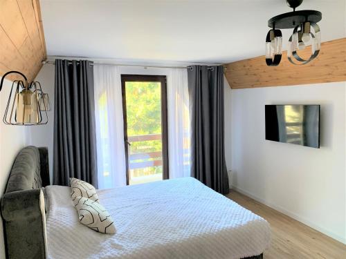 Säng eller sängar i ett rum på Holiday Home in Sinaia