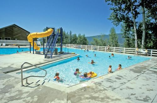 a group of people playing in a swimming pool at WorldMark Wolf Creek in Eden