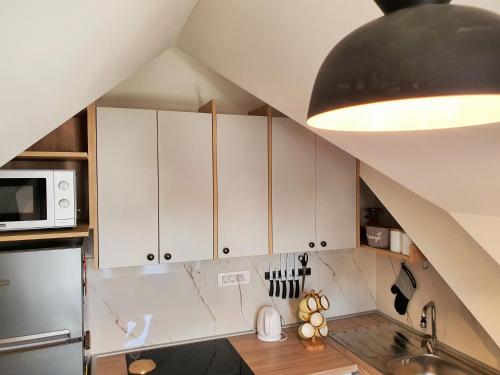 Kuchyň nebo kuchyňský kout v ubytování Downtown apartment