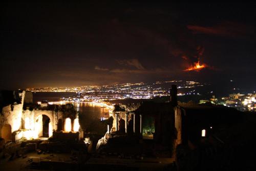 a view of a city at night at Ines bed and breakfast in Giardini Naxos