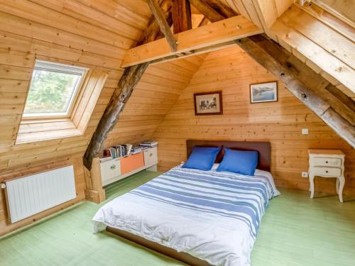 a bedroom with a bed in a wooden cabin at Holiday Home Le Patio by Interhome in Saint Malo