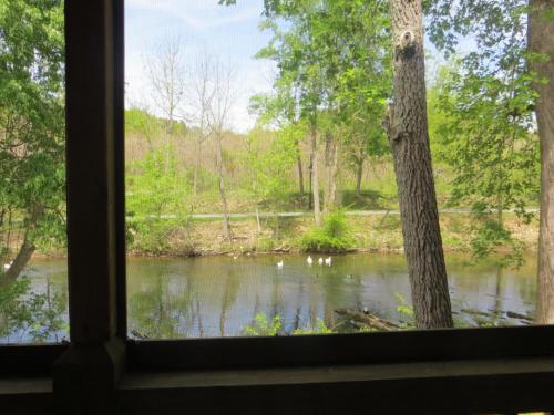 a view of a river from a window at River Place Inn in Pigeon Forge