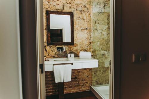 a bathroom with a sink and a mirror at 54 Santa Catarina Apartments in Lisbon