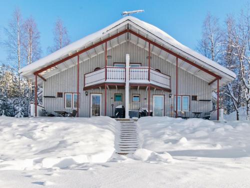 a large building with snow in front of it at Holiday Home Hallantytär b3 paritalo by Interhome in Hyrynsalmi