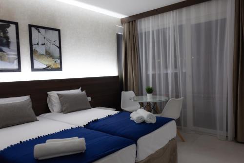 Ένα ή περισσότερα κρεβάτια σε δωμάτιο στο Villa BonnaDea