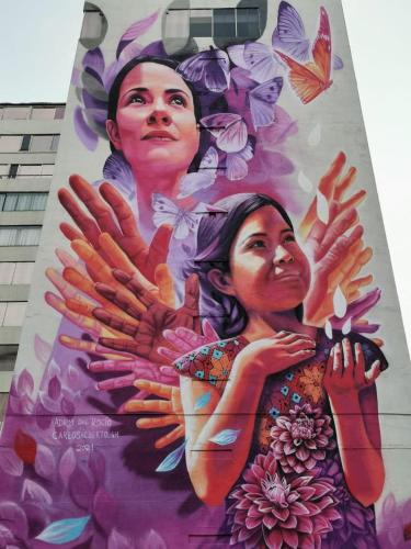 a mural of two women on the side of a building at Hotel Del Angel Reforma in Mexico City