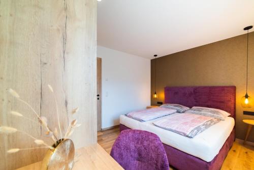 Postel nebo postele na pokoji v ubytování Marlingsuites