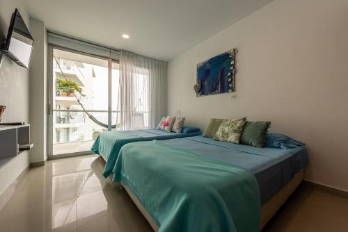 A bed or beds in a room at Edificio Morros Vitri Lujo con Panorama