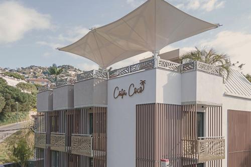 a building with an umbrella on top of it at Casa Coco Boutique Hotel & Spa 4*S - Adults Only in Lloret de Mar