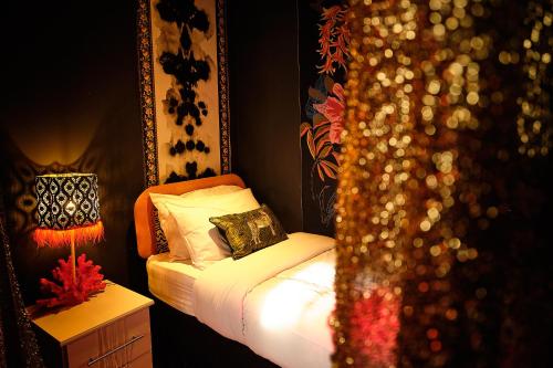 a bedroom with a bed with white sheets and pillows at The Emerald Suite by Margate Suites in Margate
