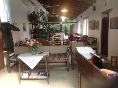 a living room with a couch and a table at Oasis Guesthouse in Chania Town