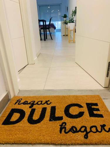 a rug on the floor of a hallway with a large dog mat at Luminosos y modernos departamentos en Rosario in Rosario