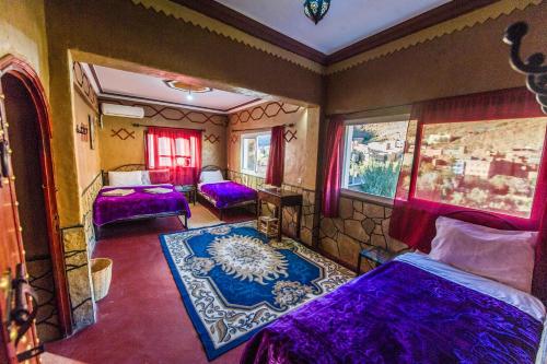 Säng eller sängar i ett rum på Les Jardins De Todgha gorges de todra tinghir