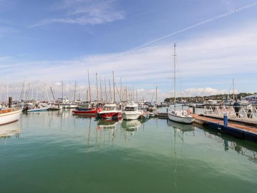 a group of boats docked in a harbor at The Old Dairy in Newport