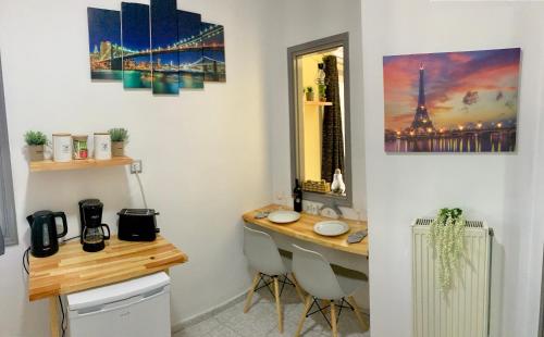 a kitchen with a sink and a mirror at George Airport Apartments in Heraklio