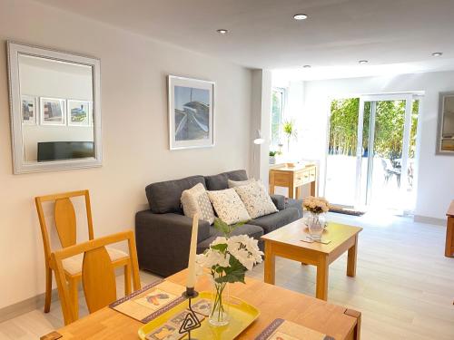 a living room with a couch and a table at Amber Lodge Hickstead-B in Haywards Heath