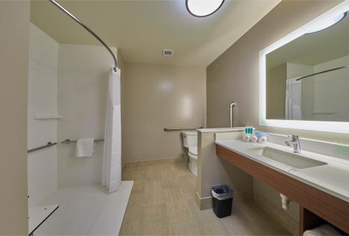 a bathroom with a sink and a mirror at Holiday Inn Express & Suites - Hermiston Downtown by IHG in Hermiston