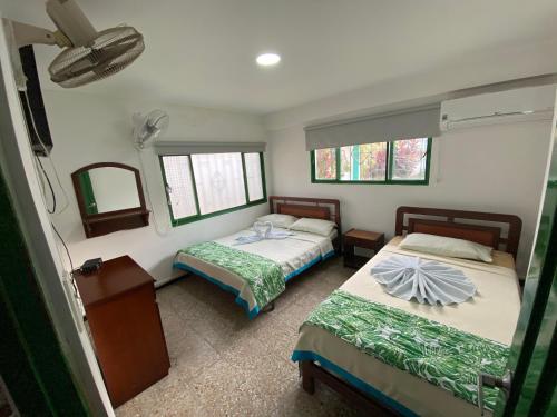 Кровать или кровати в номере Hotel Maratea Melgar