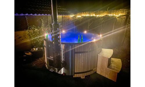 an overhead view of a swimming pool at night at Luxe vakantiehuis Drenthe 10 pers Hottub in Wateren