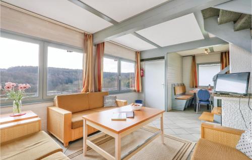 a living room with a couch and a table at Ferienhaus 46 In Kirchheim in Kemmerode