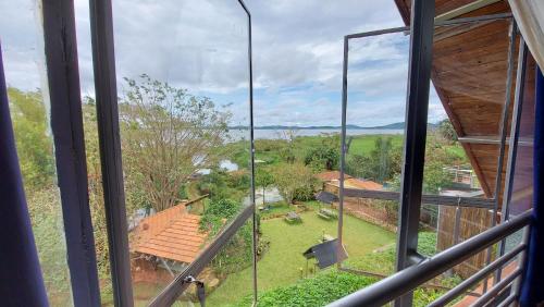 a view of a yard from a window of a house at Yellow Haven Lodge in Kampala