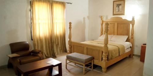 En eller flere senger på et rom på Room in Lodge - Tiffany Hotels and Towers