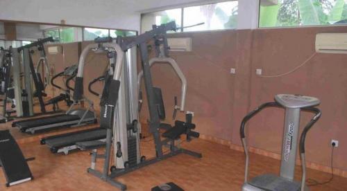 a row of tread machines in a gym at The Golf Prince Hotel in Port Harcourt