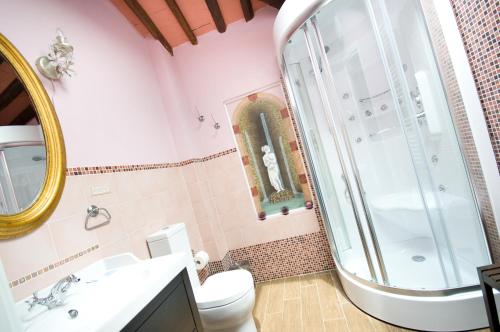 a bathroom with a shower, toilet and sink at Hotel Pisa Tower in Pisa