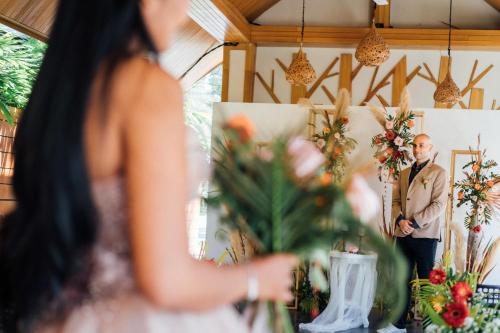 a groom seeing his bride for the first time at their wedding ceremony at Lady Naya Villas - SHA Extra Plus in Rawai Beach