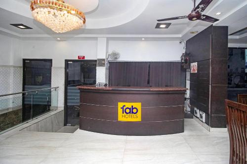 a restaurant with a bar with a job sign on it at FabHotel Arihant Inn in New Delhi