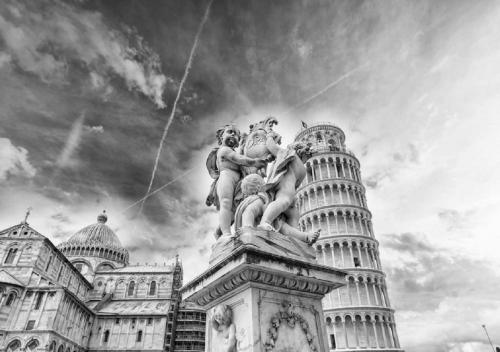 a statue of a man on top of a clock tower at Hotel Pisa Tower in Pisa