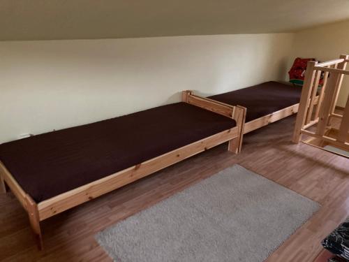 two bunk beds in a room with a rug at U Klárinky in Poštorná