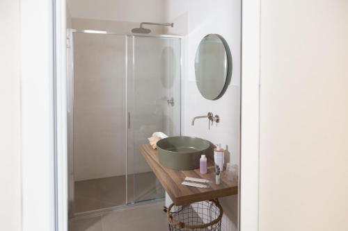 a bathroom with a sink and a shower at Marezè in Punta Secca