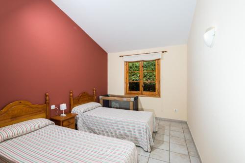 Ένα ή περισσότερα κρεβάτια σε δωμάτιο στο Villa Noixa