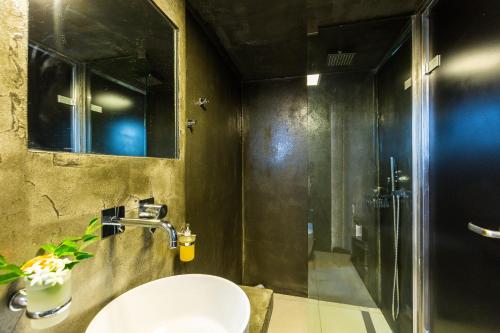 a bathroom with a sink and a shower at Villa Princess in Rethymno