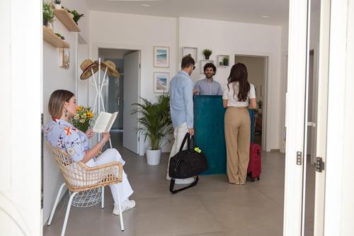 a group of people standing in a room at Marezè in Punta Secca
