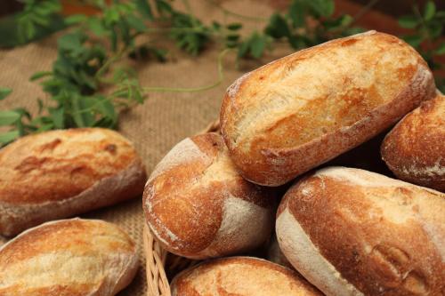 a pile of loaves of bread sitting on a table at SILA Urban Living in Ho Chi Minh City