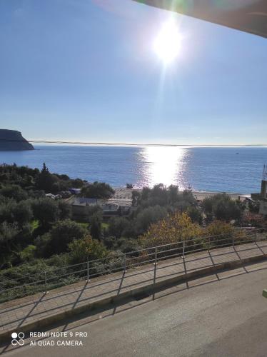 a view of the ocean from the road at Lazaris kwstas Rooms in Himare